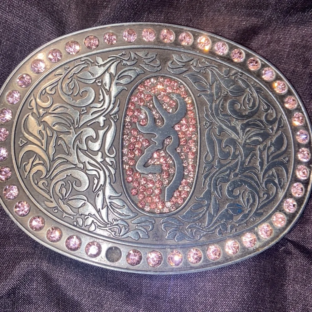 Browning Buck mark silver plated belt buckle with pink rhinestones.